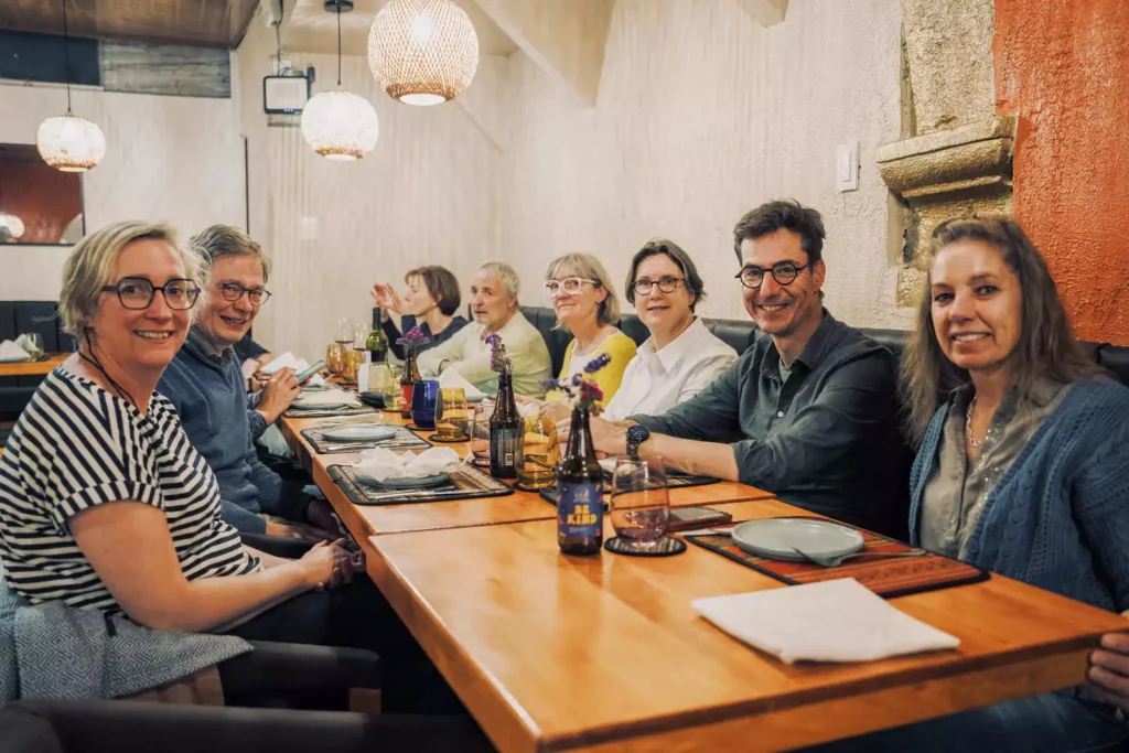 Guests enjoying dinner together at Moray restaurant, Cusco