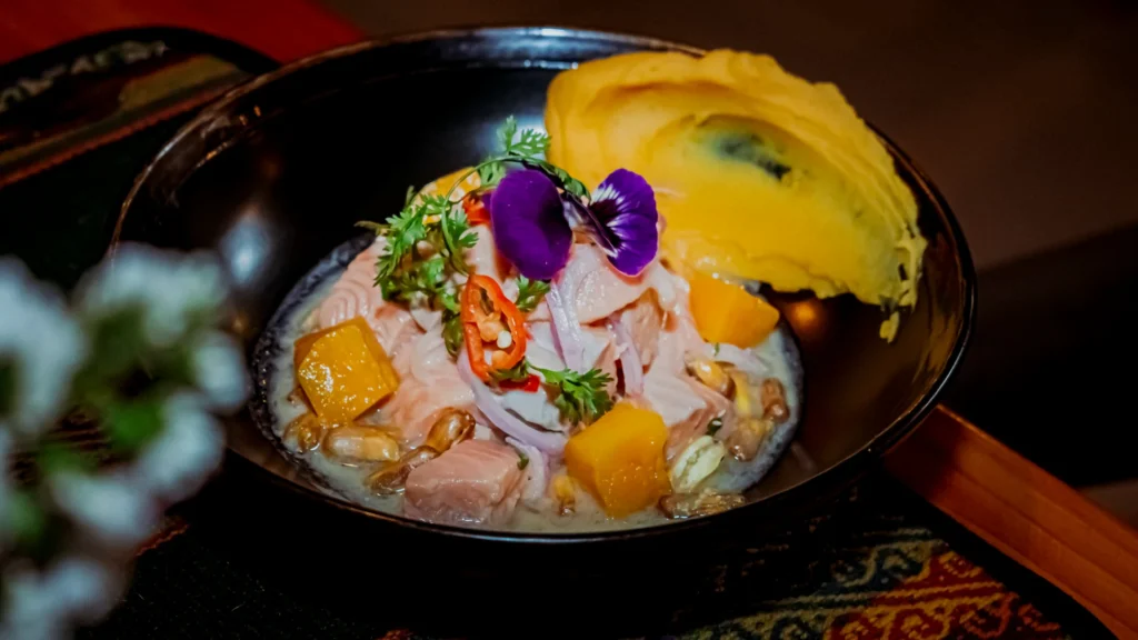 Trout ceviche with edible flowers at Moray, Cusco
