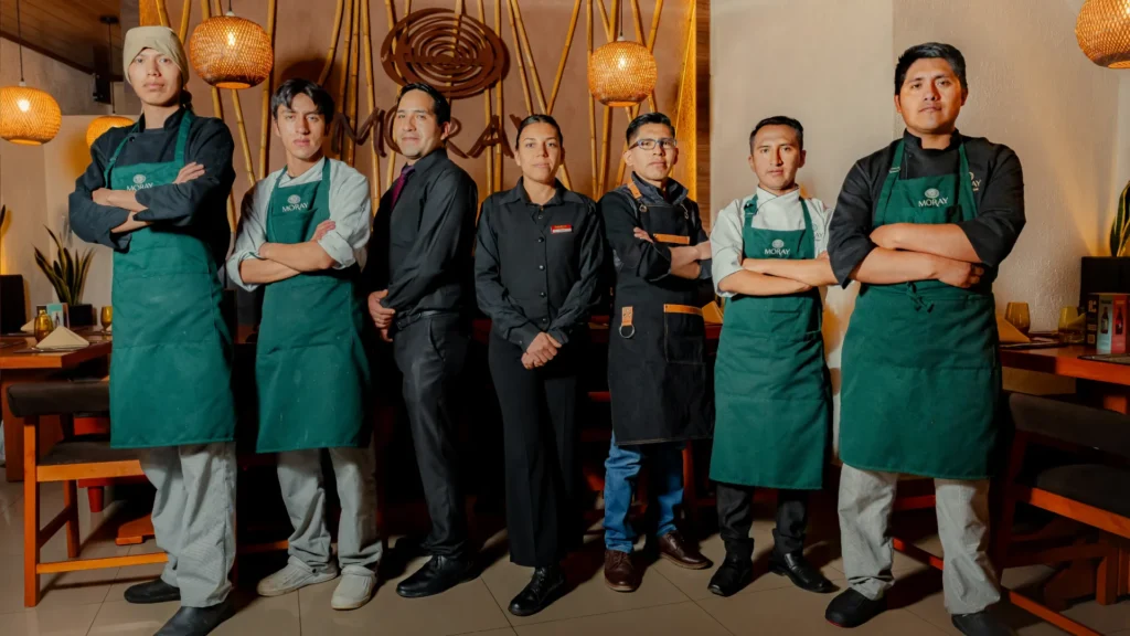 Moray kitchen team in green aprons, Cusco